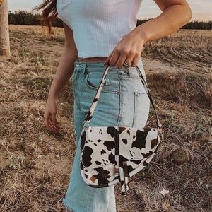 Cow print saddle bag